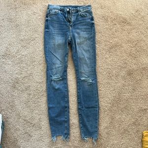 Light blue jeans with rips in the knees